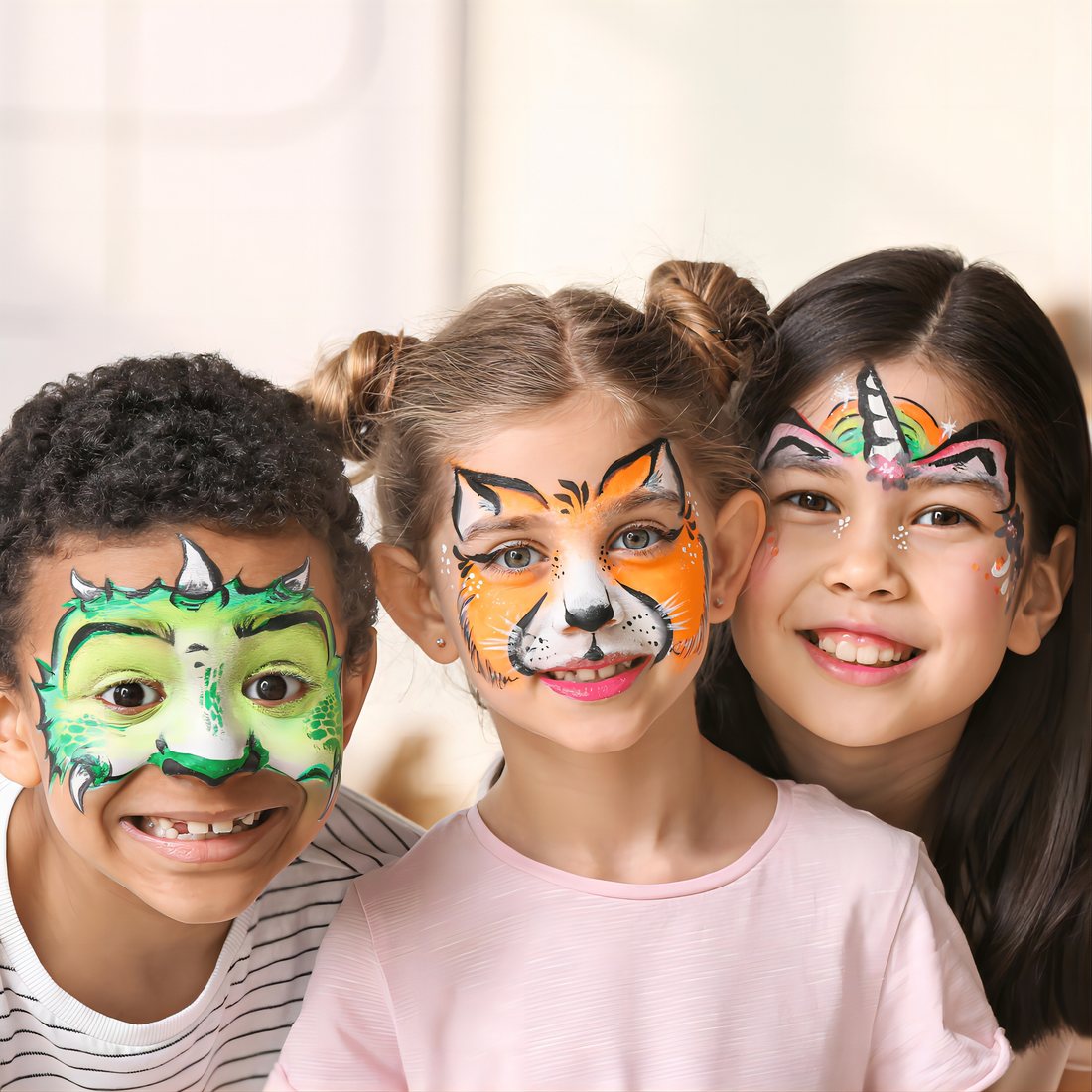 Children with faces painted using ThEast markers